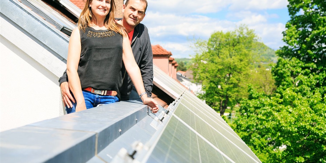 couple with solar panels on roof.jpg