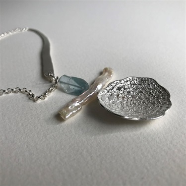 Christine Sadler, Imperfect Perfect # 9, Embossed sterling silver disc with crocheted cotton, pearl stick freshwater