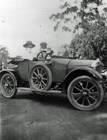 Dr. Susie O'Reilly and chauffeur 1918 Taken in 1918 while wearing face masks due to the  flu epidemic in Sydney.