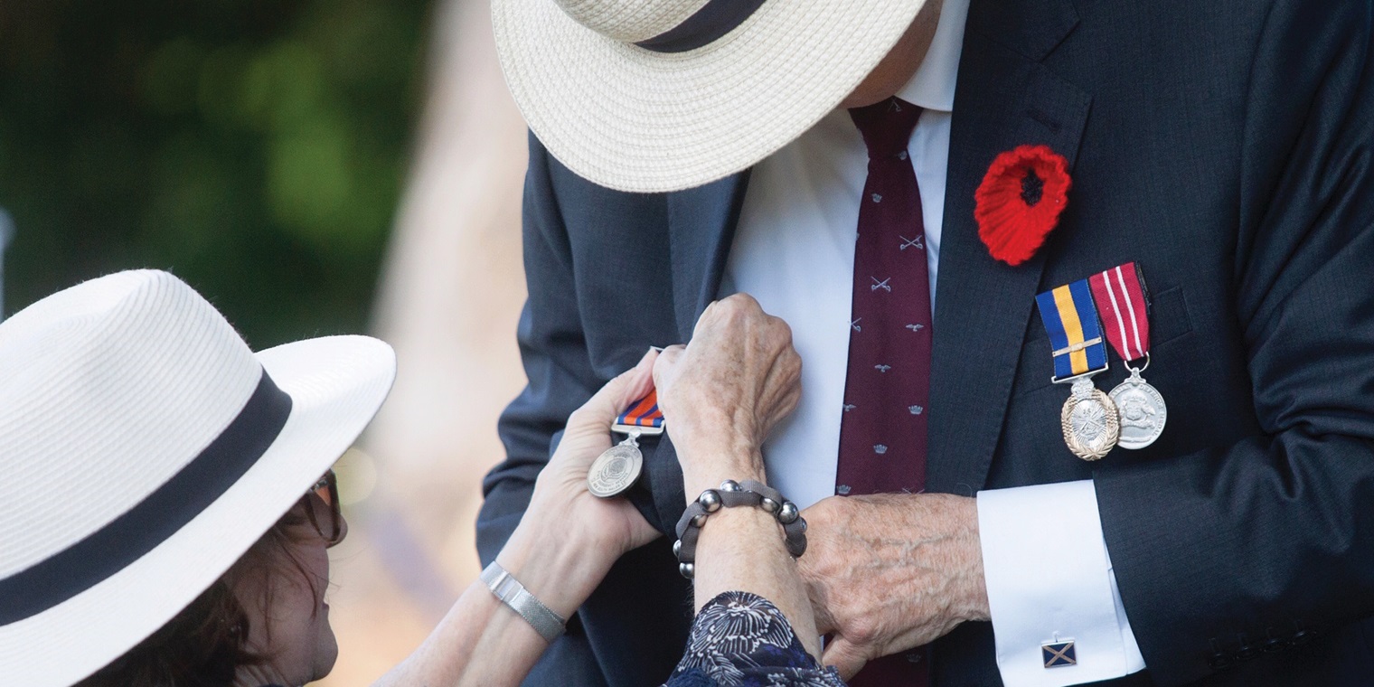 pinning anzac medal